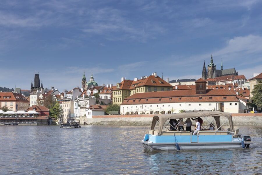 Prague: Beer Boat Tour - Sailing past Charles Bridge: the classic view with a moving twist