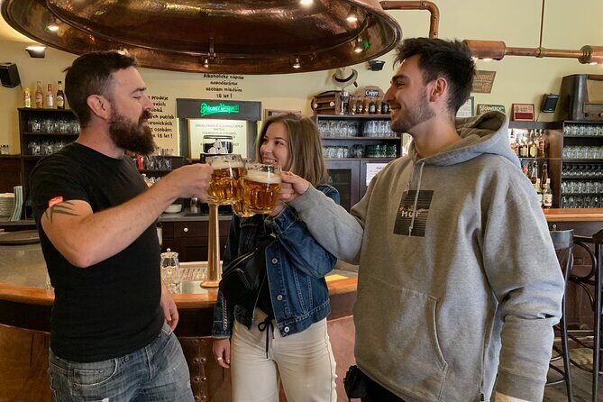 Prague Historic Pub Tour with Drinks Included - Charles Bridge walk: cobblestones, Jewish quarter atmosphere, and a big-photo route