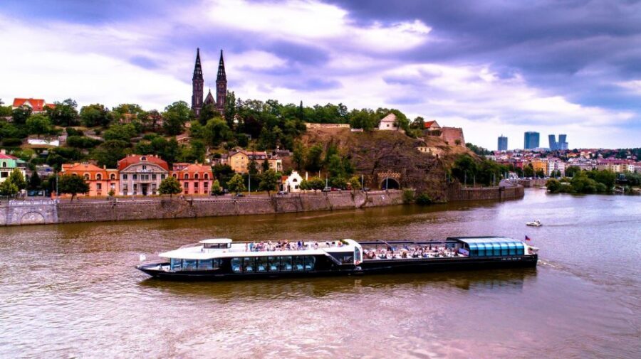 Prague: Sightseeing Dinner Cruise on Open-Top Glass Boat - Boarding at the Pier: Getting Positioned for Great Views