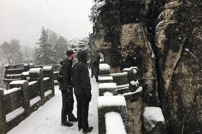 Winterland Tour to Bohemian and Saxon Switzerland from Prague - Pravčická brána or Tisá Rocks: your guided 2 km hike with a warm reward